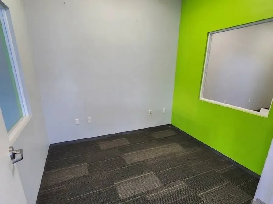 The same office emptied after the desk was removed