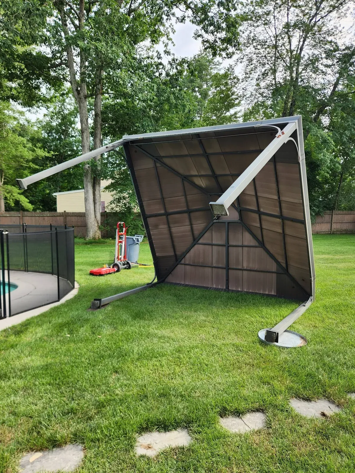 Gazebo roof taken down and lying on the lawn